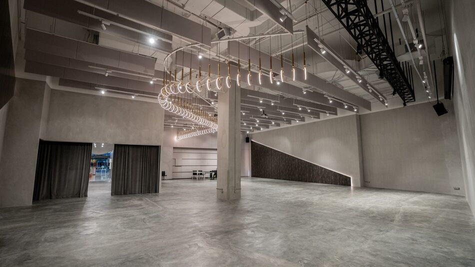The Grey Box main hall seen from the far end, curtains drawn along one wall